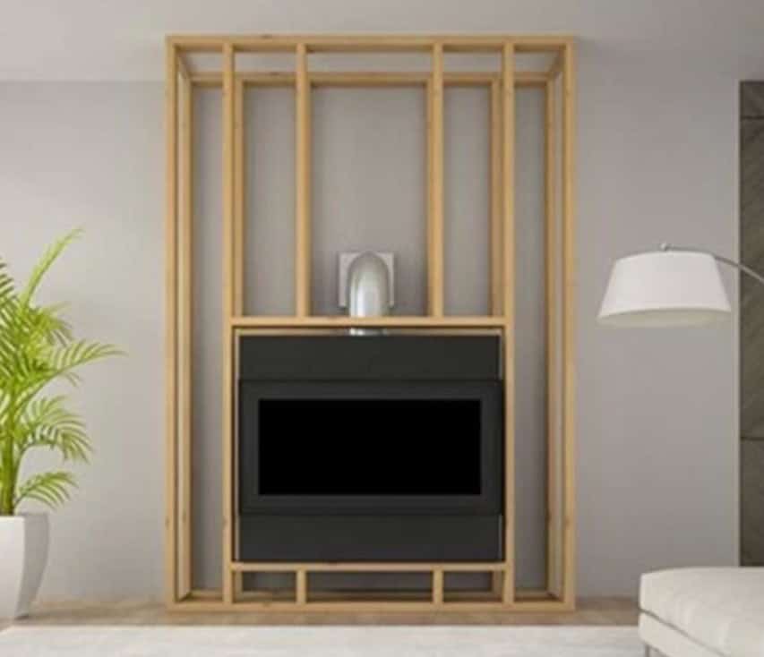 photo of a builtin zero clearance factory built gas fireplace being installed in framing before finishes